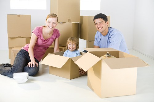 Movers carrying items through a residential stairwell