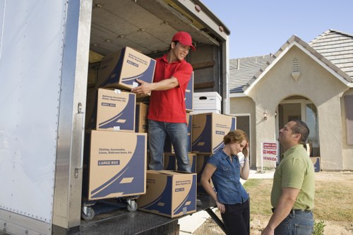 Careful wrapping of household items during an Eltham move
