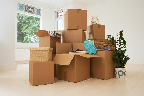 Packed moving boxes and furniture prepared for transport